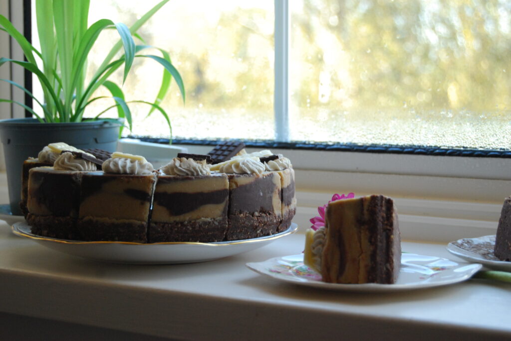 The cake sits on a windowsill.