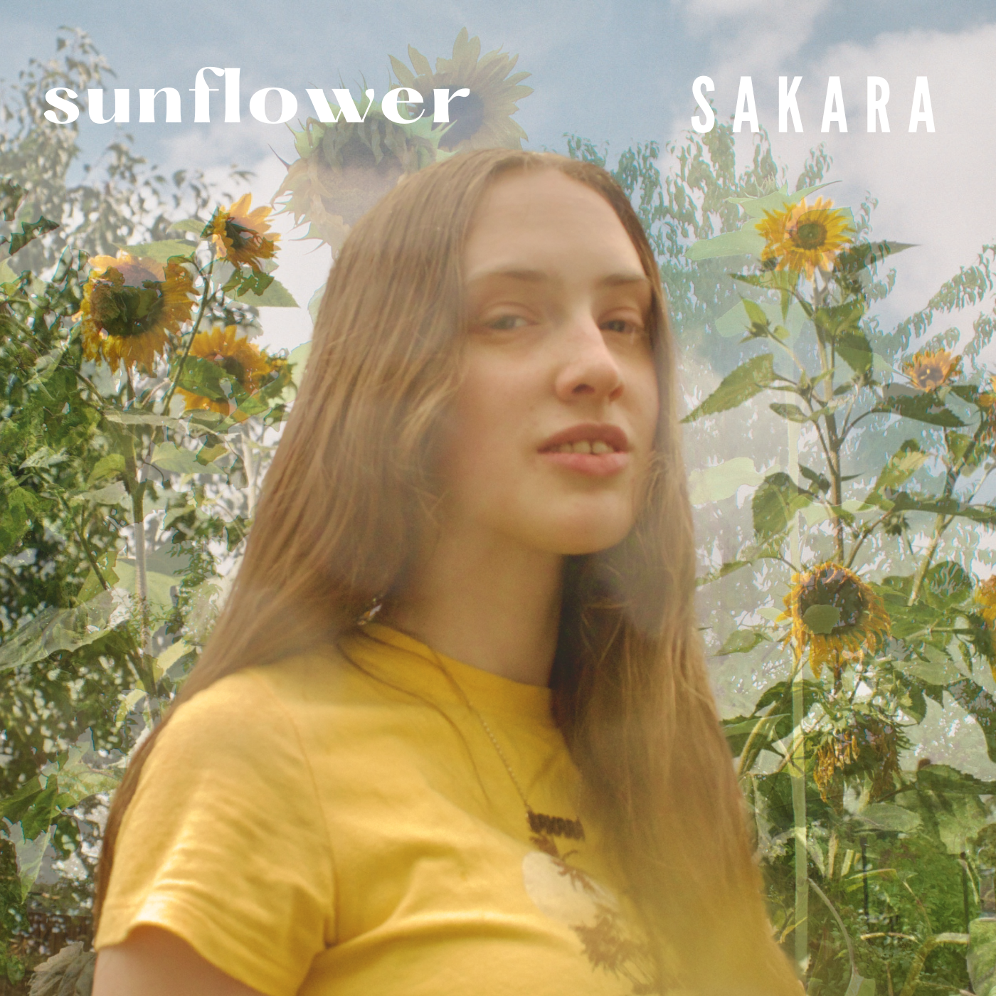 Sakara's single cover art for the track Sunflower shows her standing in front of some flowers wearing a yellow t-shirt.